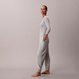 Calvin Klein JOGGER Womens Grey Heather side view of a model wearing joggers made from 85% cotton and 15% polyester.