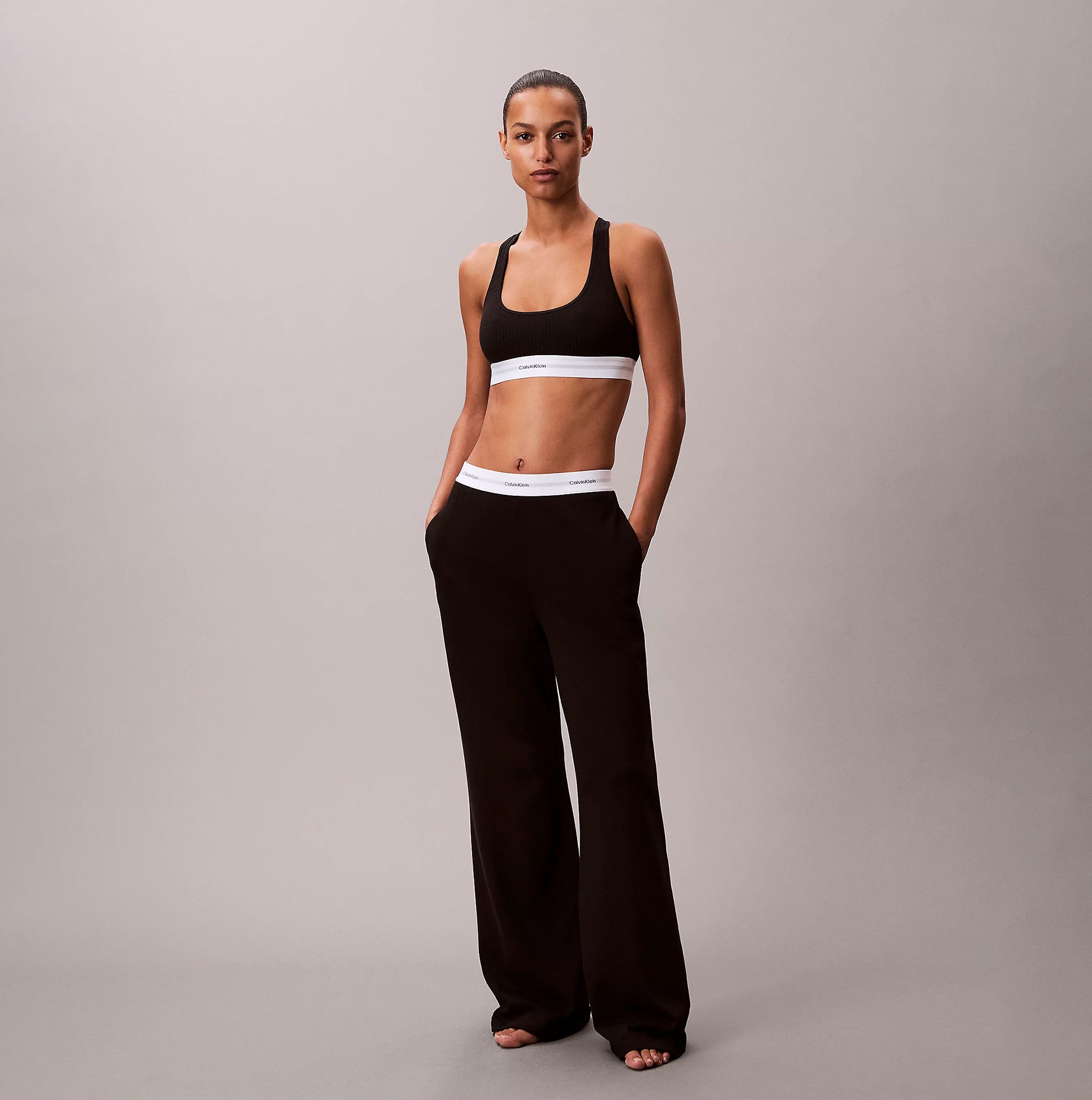 Calvin Klein LOGO JERSEY PANT Womens Black front view model showing stylish design and comfortable fit.