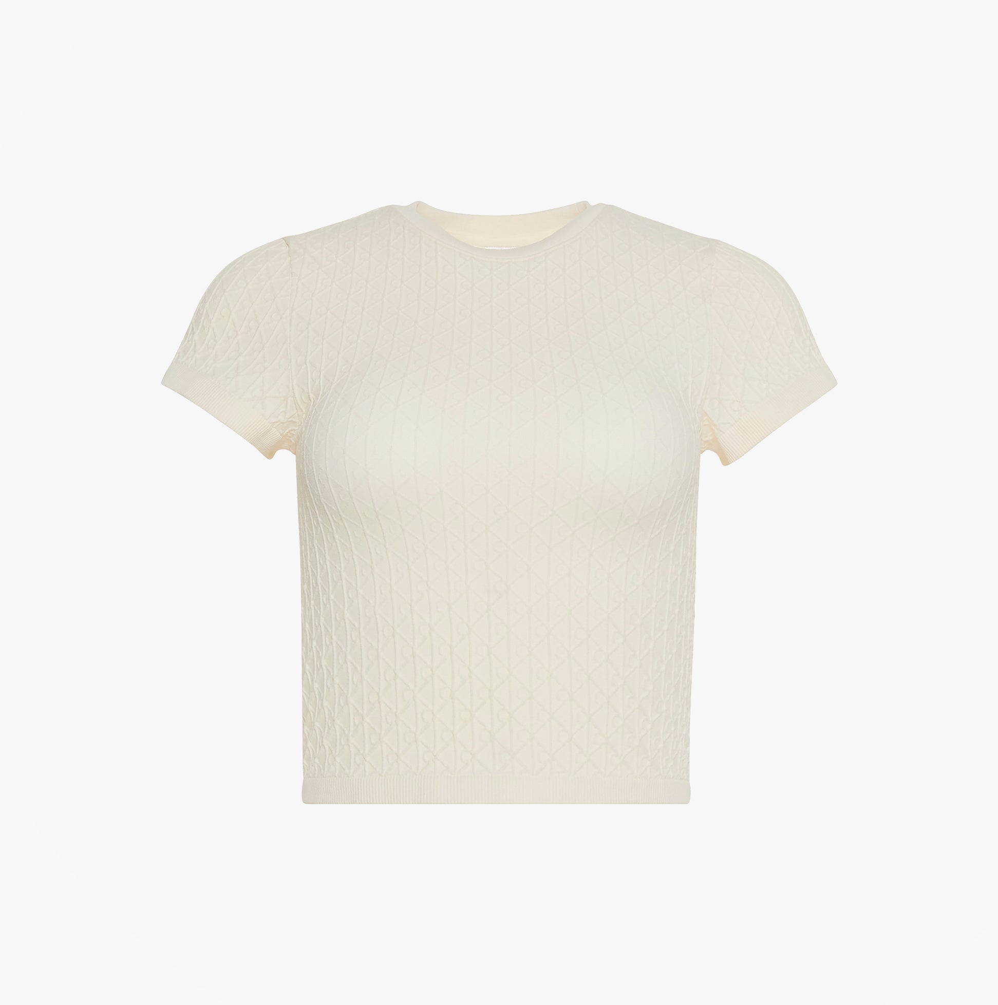 Calvin Klein SEAMLESS TEE Womens Printed CK Knit T-Shirt Ivory front view showing short sleeves and textured fabric.