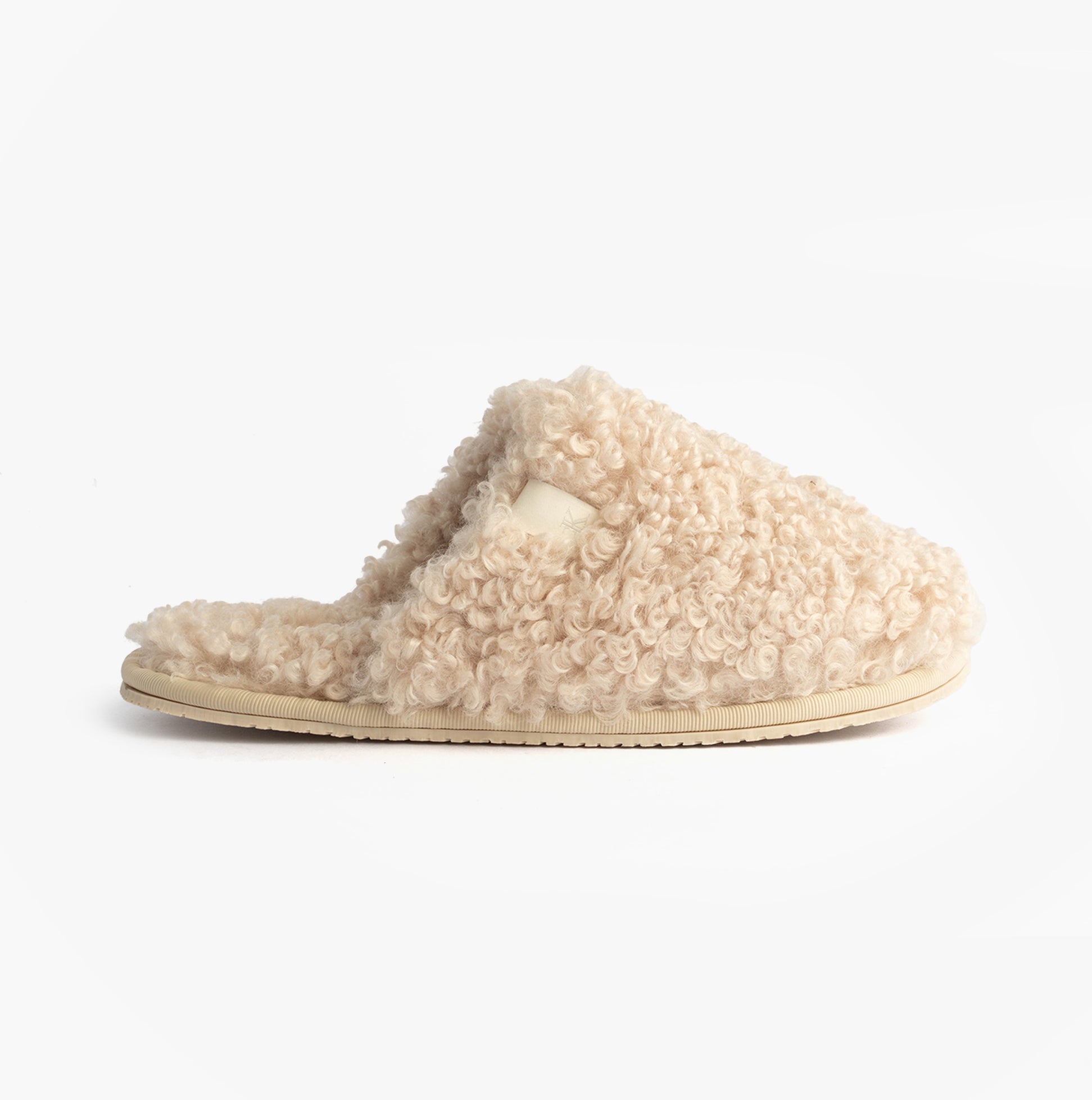 Calvin Klein CLOSE SLIPPER FUR Womens Slippers Marshmallow side view showcasing plush faux fur and lightweight design.