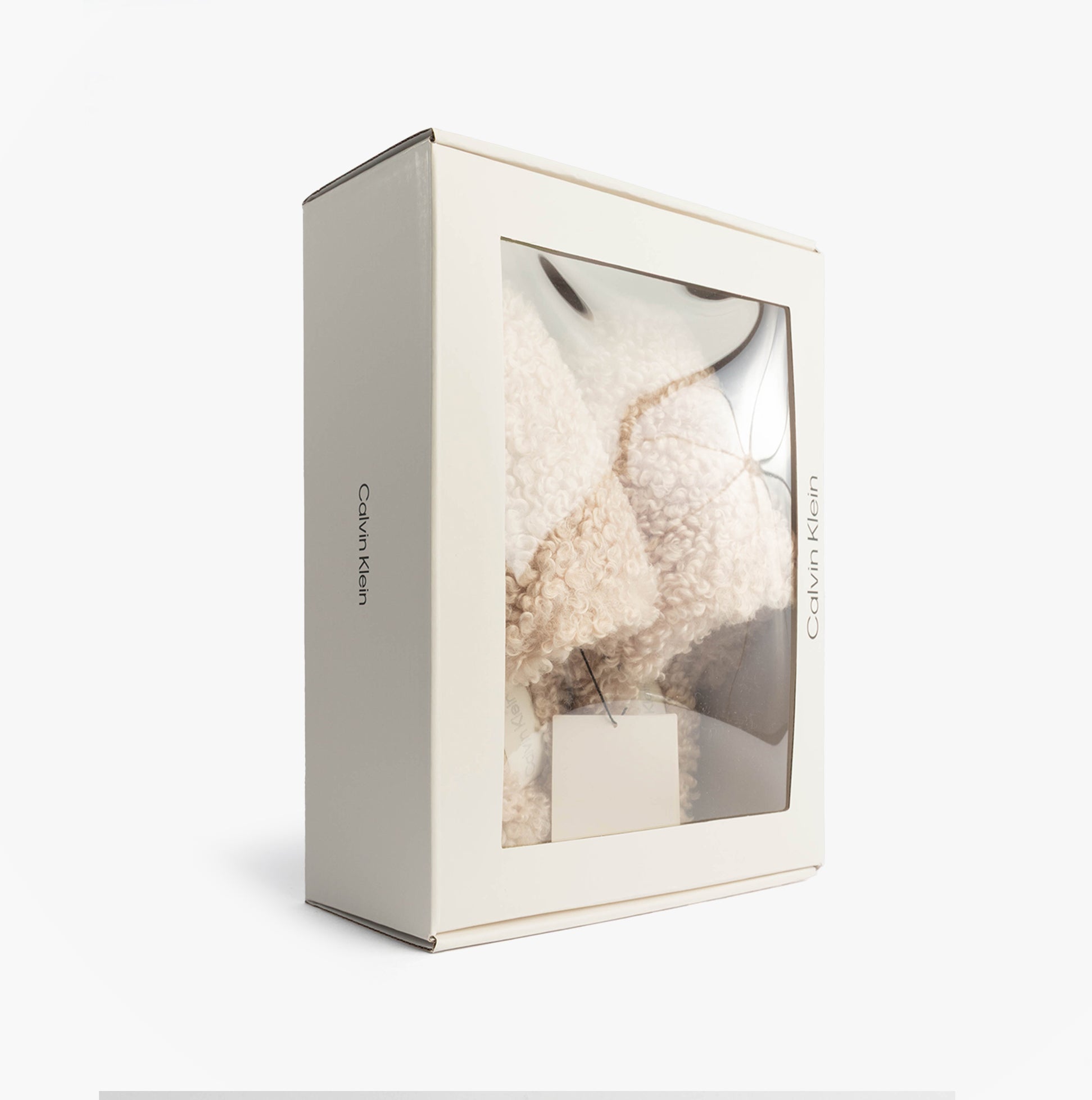 Calvin Klein CLOSE SLIPPER FUR Womens Slippers Marshmallow in gift box, side view with transparent window.