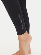 Calvin Klein GYM SIDE LOGO Leggings Black detail view of logo on calf