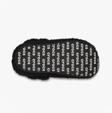 Top view of Crocs CLASSIC COZZZY Unisex Slippers Black showcasing faux fur lining and printed logo pattern.