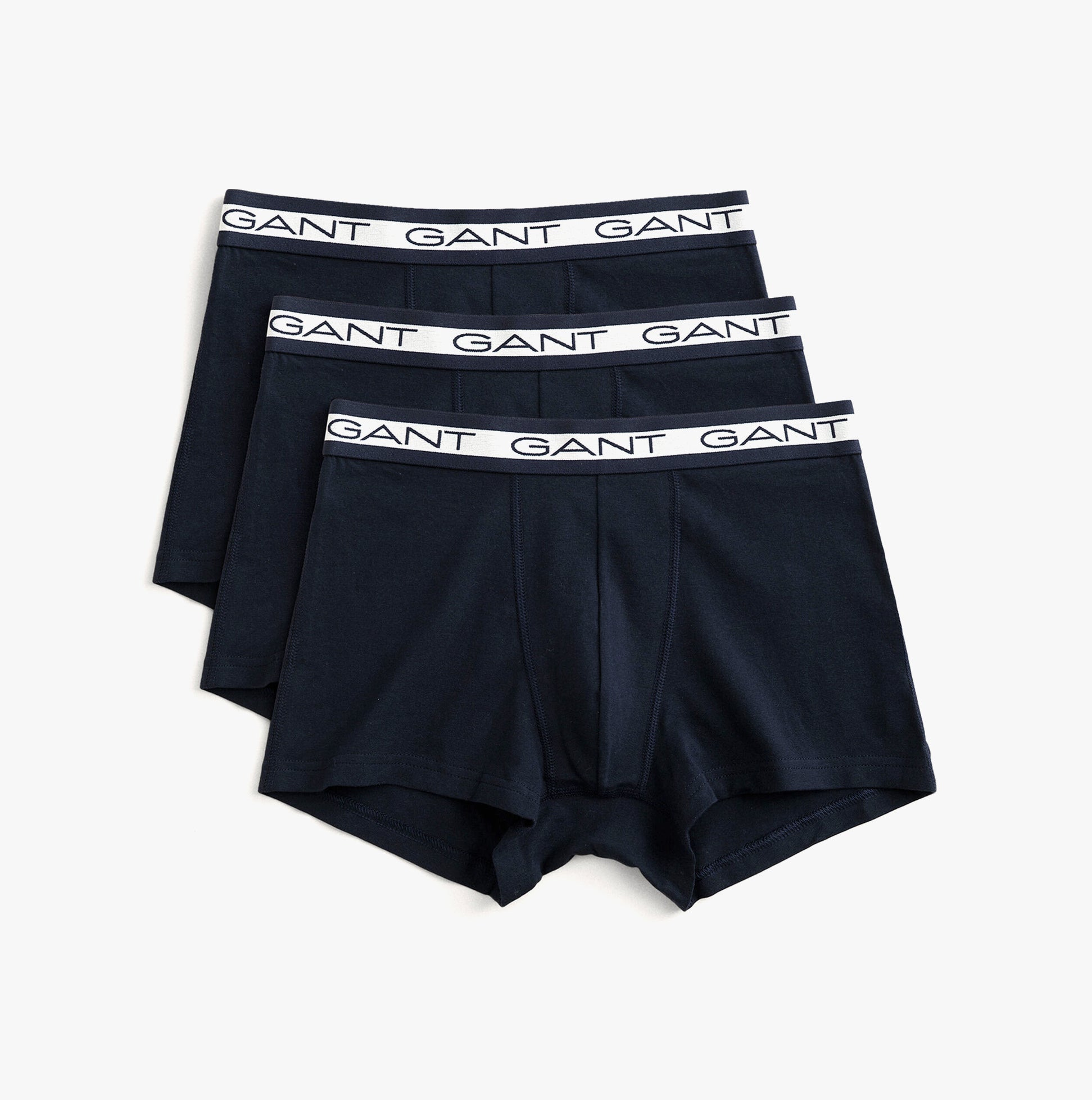 GANT CORE Mens 3 Pack Trunks Marine, front view showing three navy trunks with white GANT logo waistband.