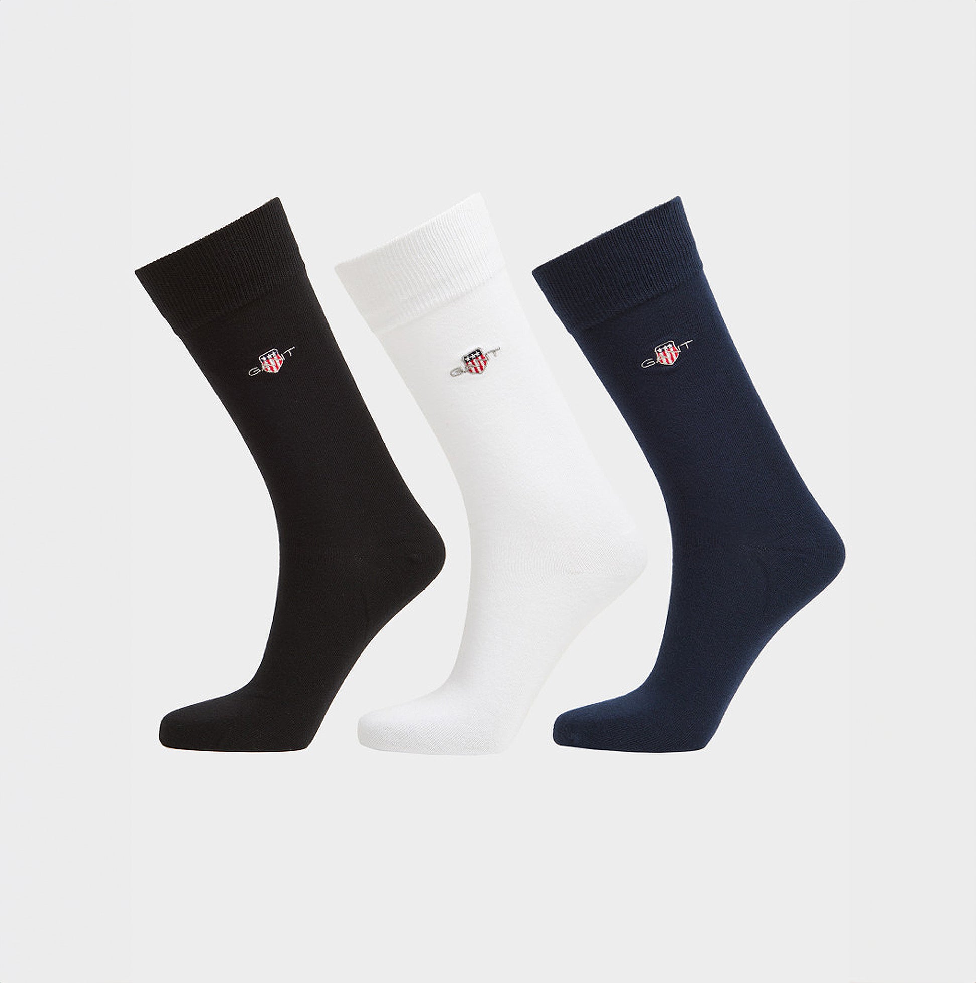 GANT SHIELD SOCKS 3-Pack Mens Black side view showing black, white, and navy crew socks with logo