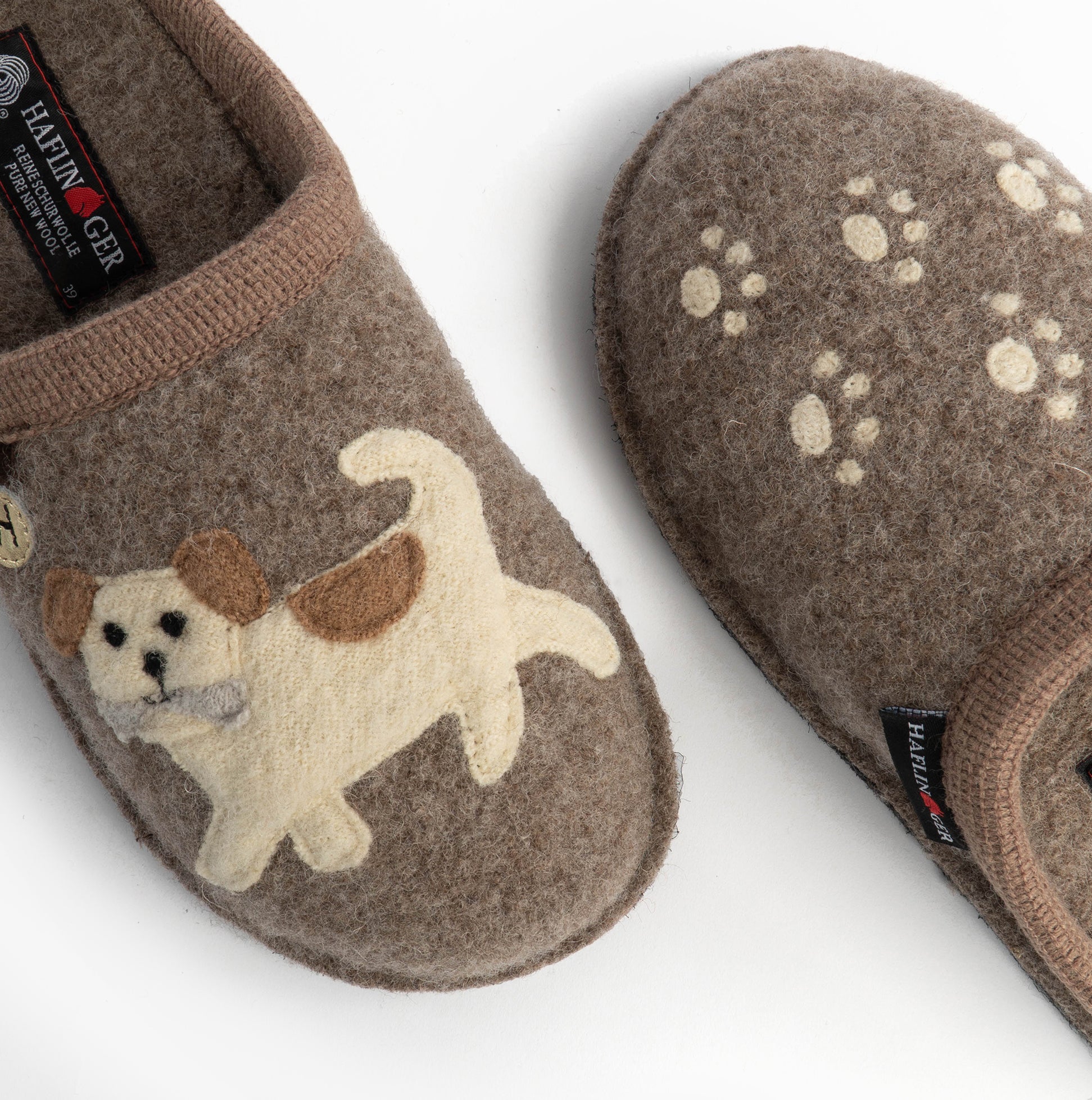 Haflinger FIDO Womens Slippers Beige side view showcasing adorable dog design and paw prints on upper.