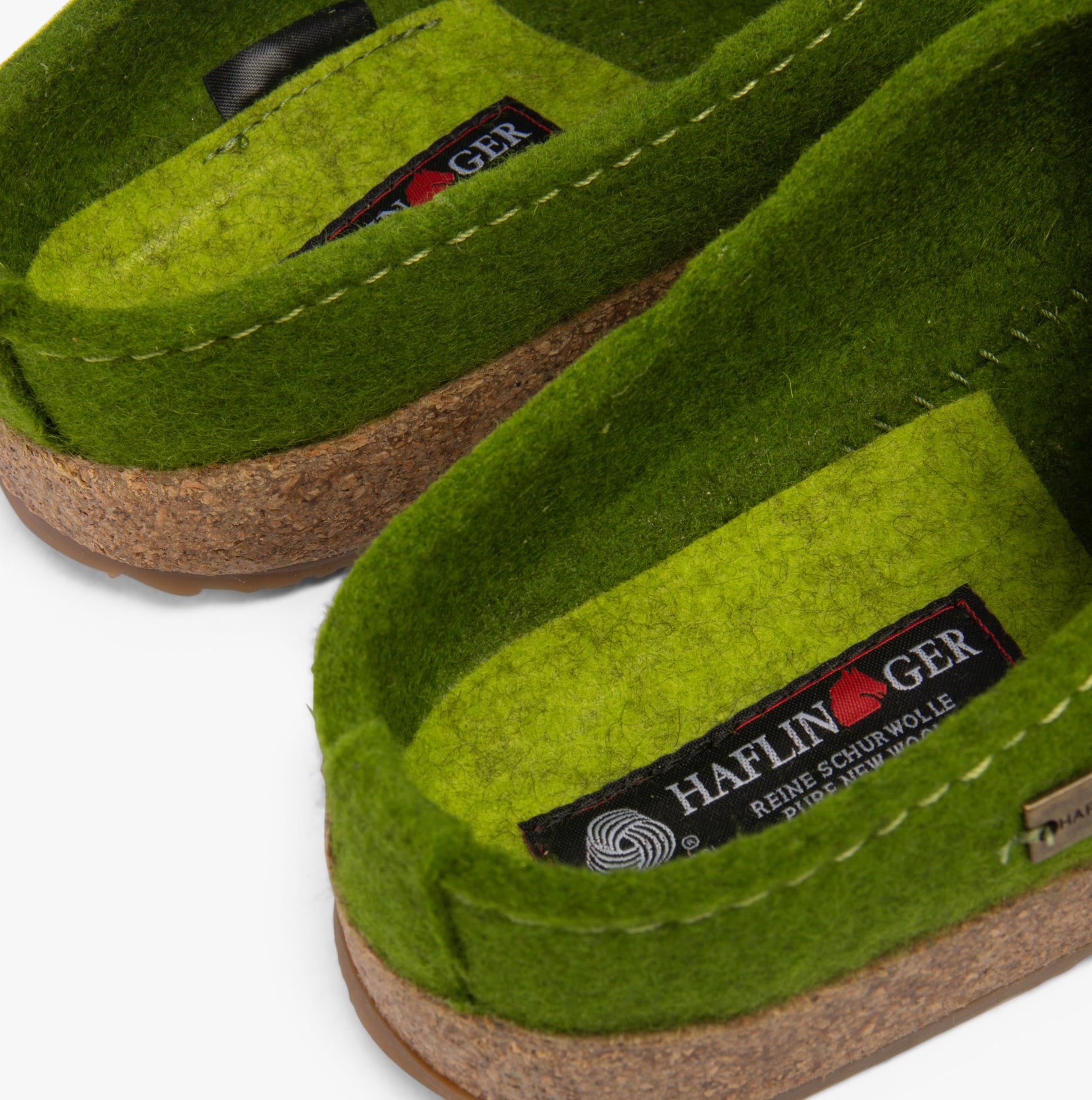 Haflinger KANON Womens Slippers Green detail view showcasing felt upper and rubber sole.