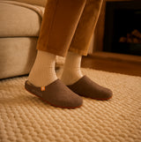 Hush Puppies THE GOOD SLIPPER Mens Slippers Brown side view worn by a person sitting on a couch.