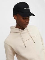 Jack & Jones VESTERBRO Mens Cap Black front view worn by model with hoodie.