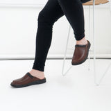 Josef Seibel MAX Mens Clogs Brandy side view worn on foot with black pants, showcasing slip-on design and brown leather.