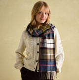 Joules LANGTREE Womens Scarf Green Pink Check on model, styled with cream cable-knit sweater, showcasing the check pattern and tasselled ends.