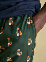 Joules DOZER Pyjama Bottoms Fenton Fox detail view showcasing Fenton Fox pattern in green fabric with side pockets.