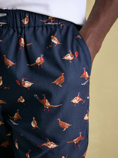 Joules DOZER Pyjama Bottoms Game Birds side view showing detailed bird patterns in navy fabric with side pockets.