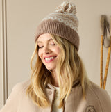 Joules KARA BOBBLE Womens Bobble Neutral beanie hat with pom pom, front view on model, smiling.