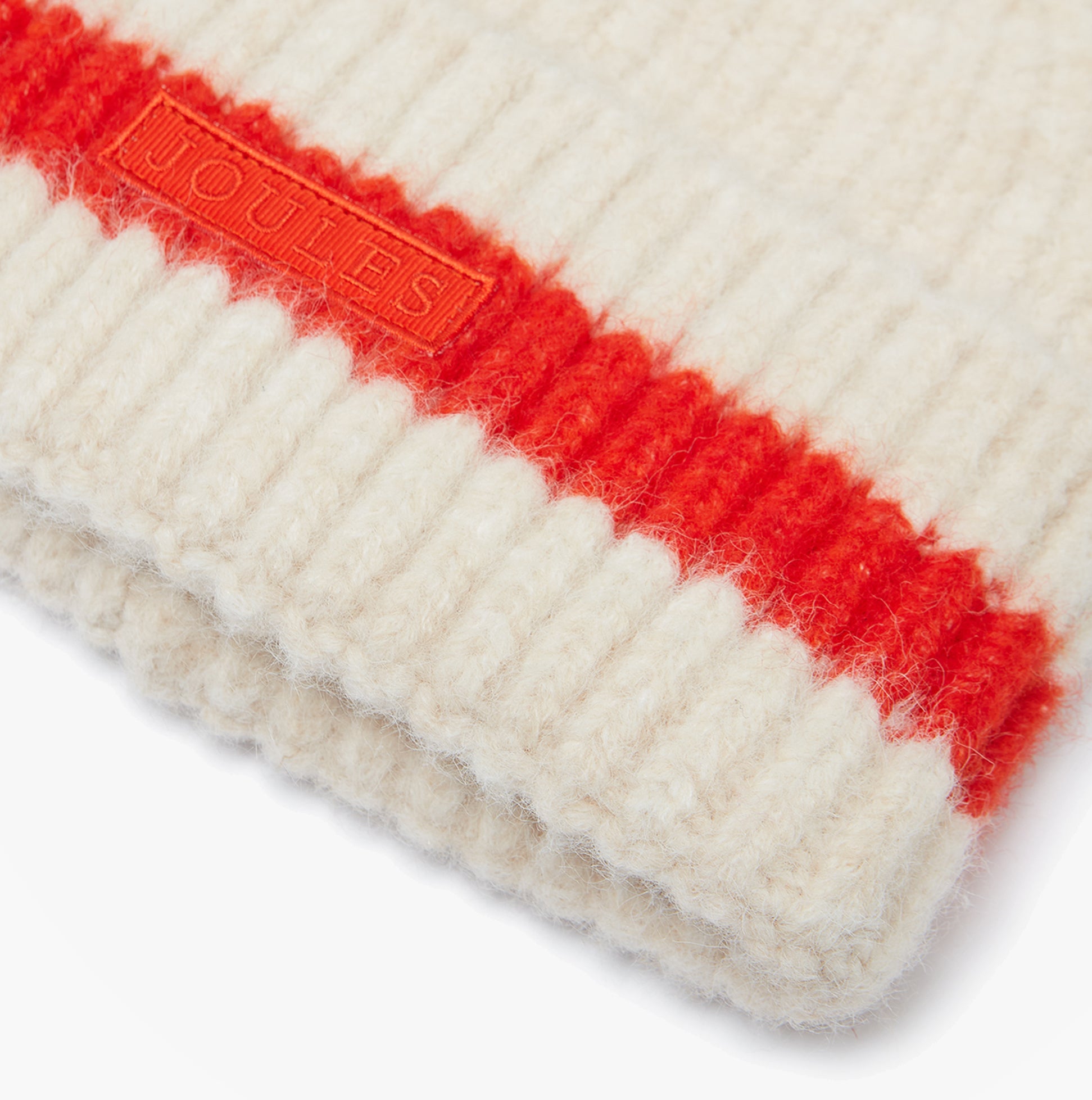 Joules POPLEY STRIPE Womens Beanie Orange/Neutral detail view showcasing the texture and logo on the beanie.