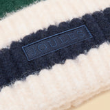 Detail view of Joules POPLEY STRIPE Womens Beanie Green/Blue featuring the Joules label.