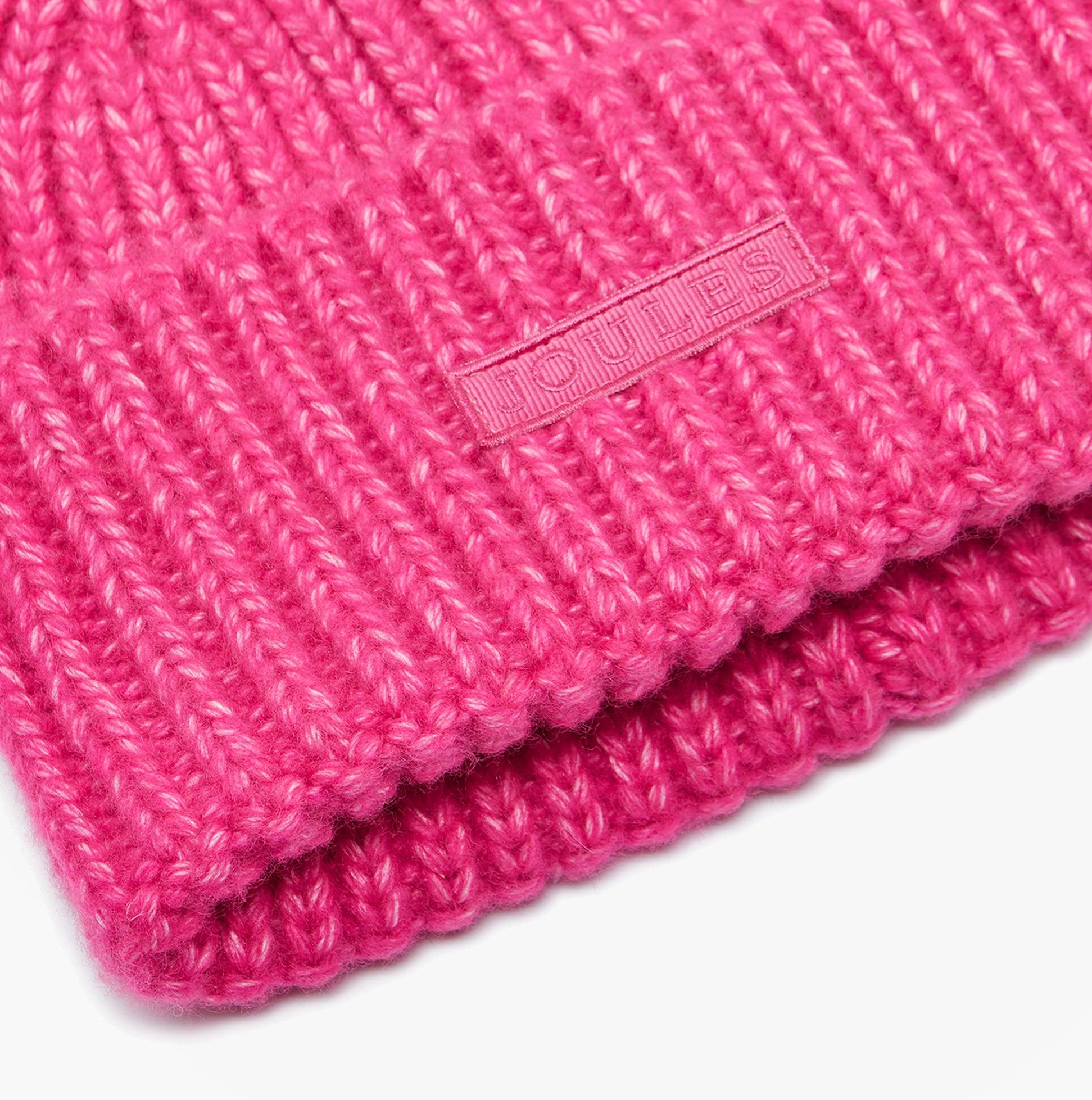 Joules ROSA Womens Beanie Pink close-up detail view showcasing the vibrant texture and brand logo.