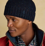 Joules HAMMOND Mens Beanie Navy side view worn by model, showcasing the ribbed design and colorful speckles.