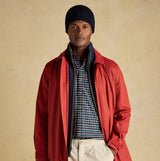 Joules HAMMOND Mens Beanie Navy worn by a model in front view, paired with a red coat and checkered shirt.