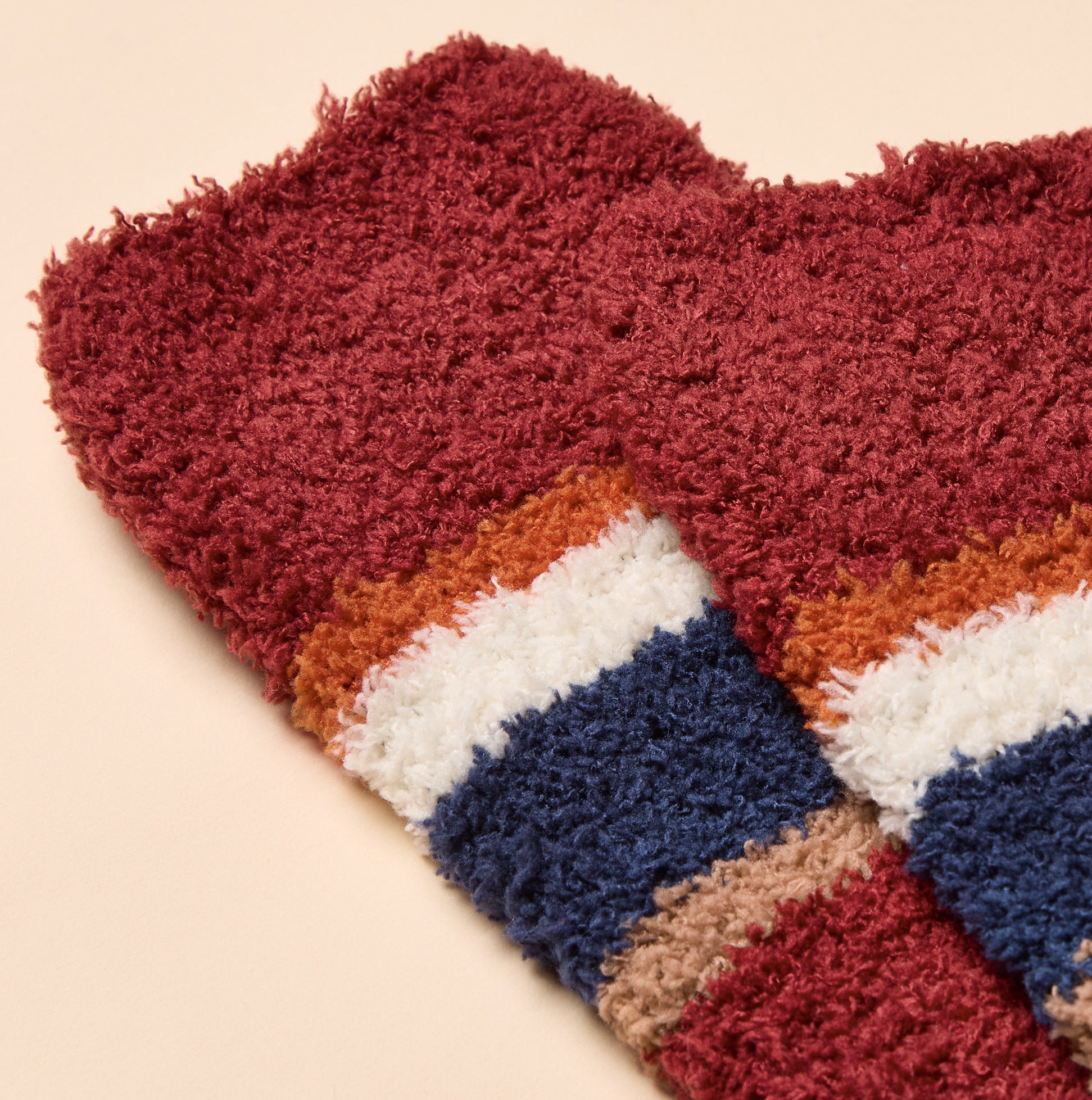 Joules FLUFFY Mens Socks Red, close-up view showcasing soft material and vibrant striped design.