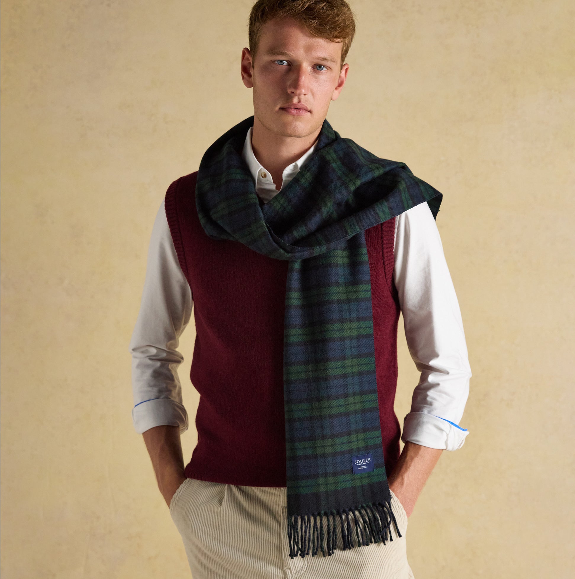 Joules LANGTREE Mens Scarf Navy on a model, front view, draped elegantly with casual attire.