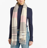 Joules LANGTREE Womens Scarf Pink/Grey front view on model, showcasing plaid design and fringe details.