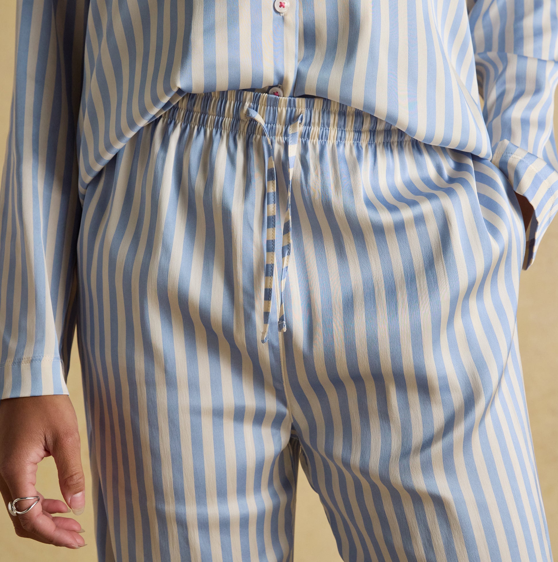 Joules BONNIE Womens Satin Pyjama Set Blue Stripe detail view showing striped fabric and waistband.