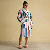 Joules MATILDA Womens Robe Multi side view of a woman wearing a colorful striped robe with white shawl collar.
