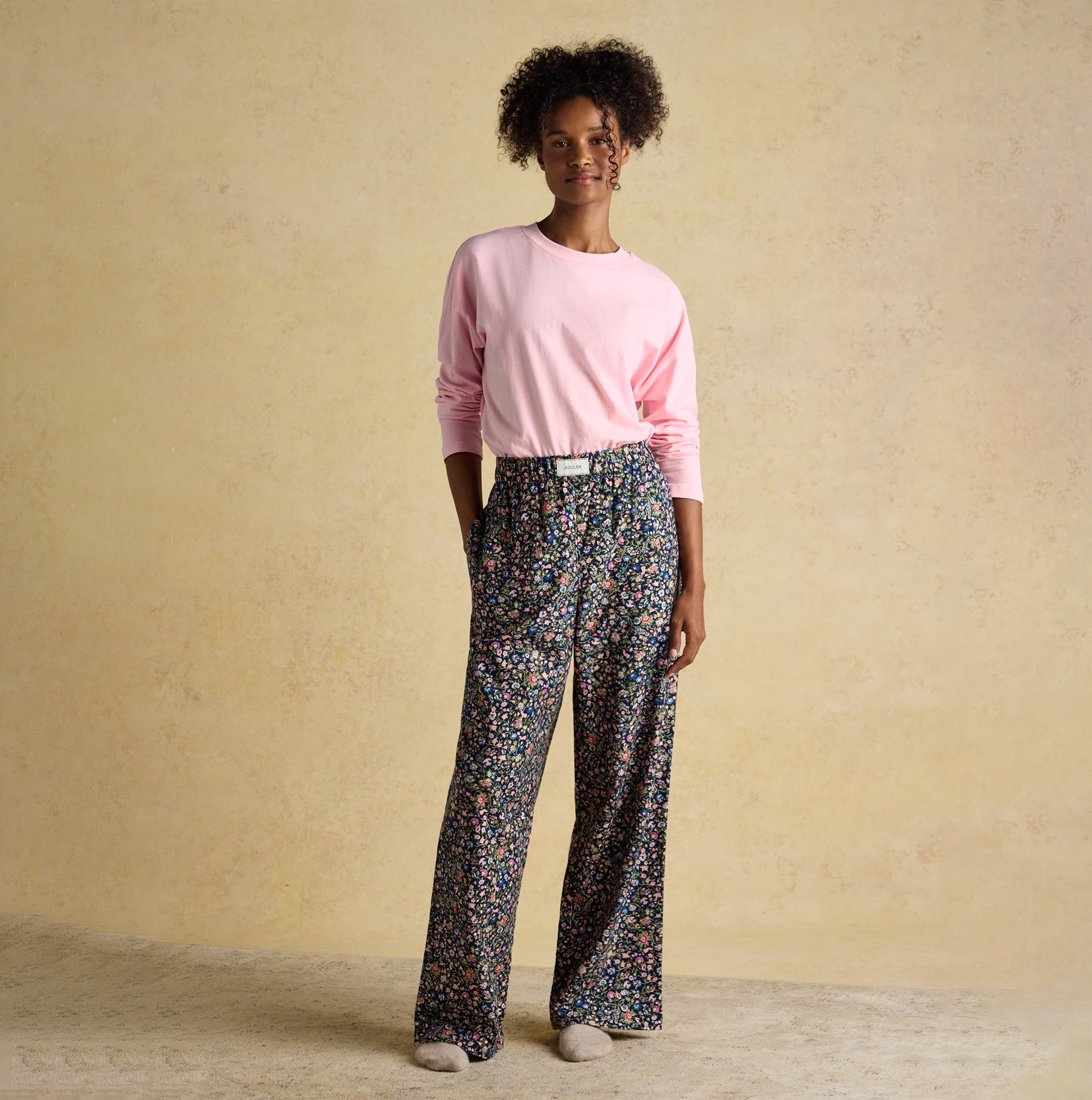 Joules STELLA Womens Pyjama Bottoms Navy/Pink front view with model, relaxed fit, floral design, 100% cotton.
