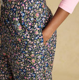 Joules STELLA Womens Pyjama Bottoms Navy/Pink side view showcasing floral design and pocket detail.