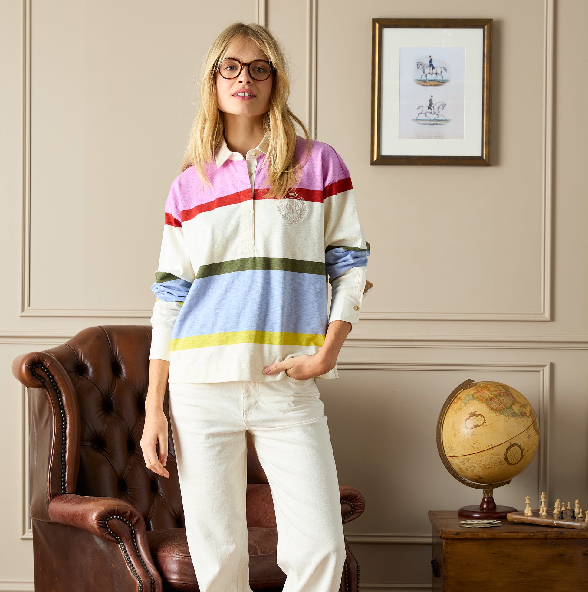 Joules LARA SLUB Womens Rugby Shirt Multi front view, featuring colorful striped design, worn with white trousers.