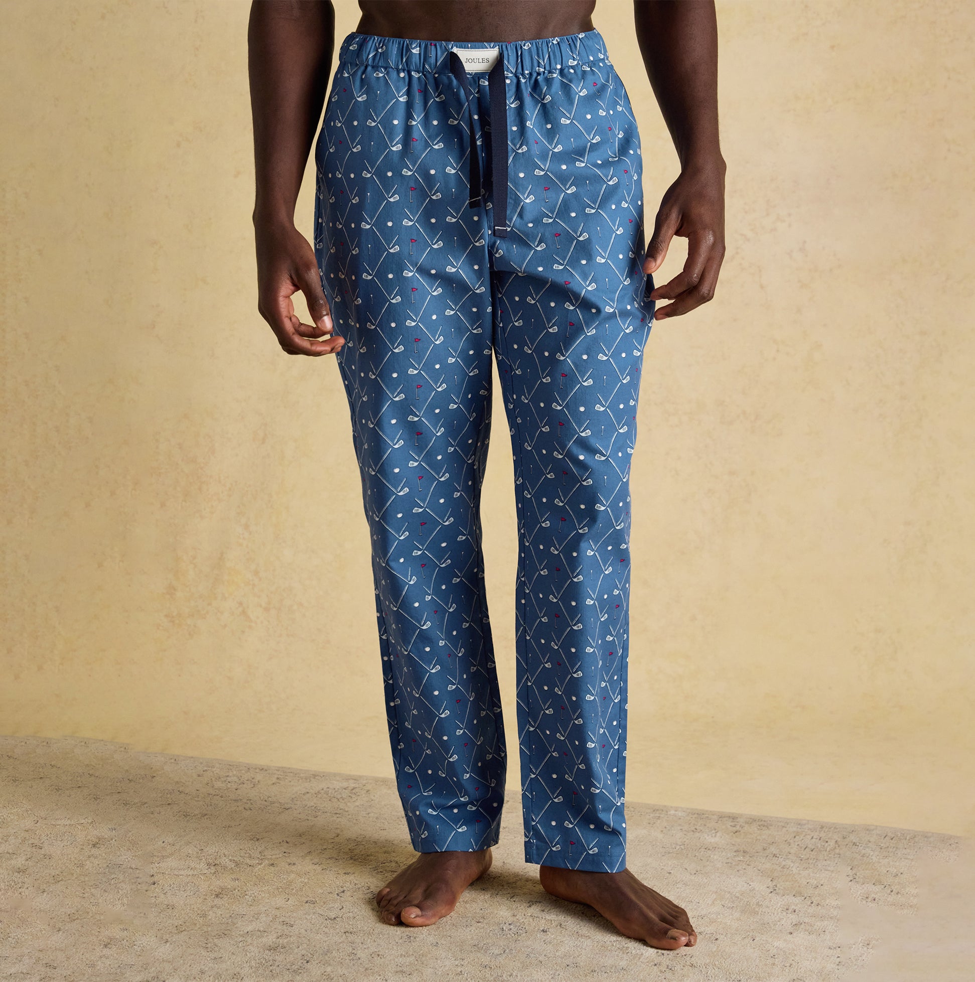 Joules DOZER Mens Pyjama Bottoms Blue front view showing relaxed fit and cotton material with a patterned design.