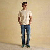 Joules RUGBY CLUB TEE Mens T-Shirt Cream front view worn by a male model with blue jeans.