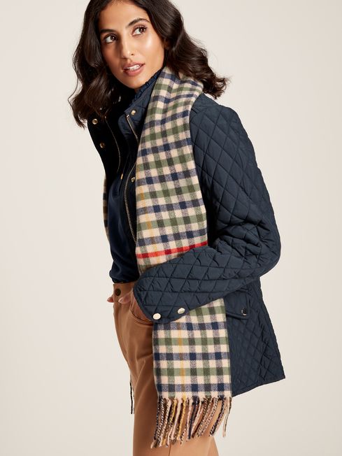 Joules LANGTREE Womens Scarf Henson Check side view on model, featuring a heritage check pattern and tasselled ends.