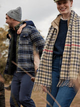 Joules LANGTREE Womens Scarf Henson Check worn by a woman in a front view, featuring a heritage check pattern and tasselled ends.