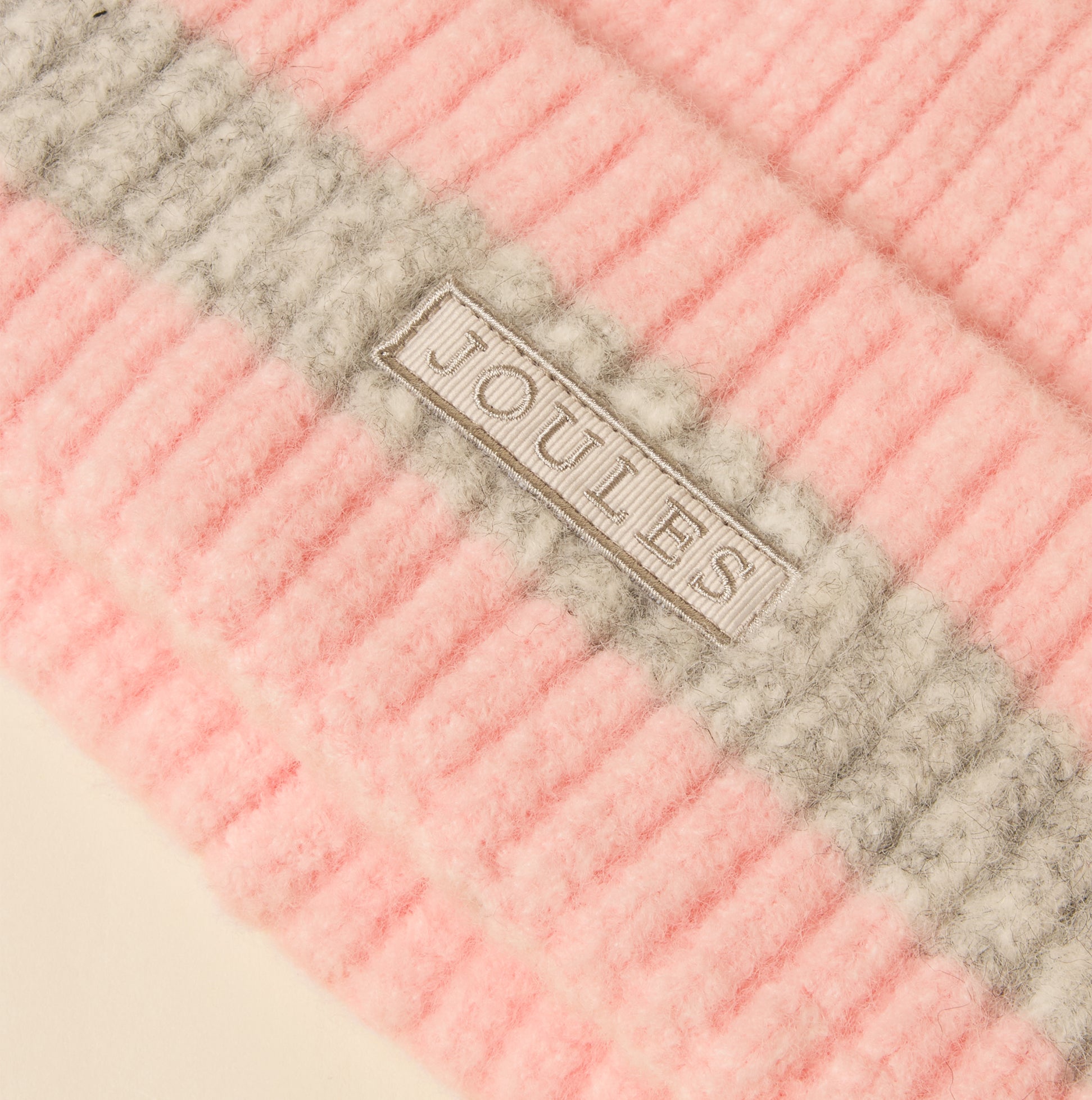 Joules POPLEY STRIPE Womens Beanie Pink/Grey detail view showing the tag and texture of the fabric.