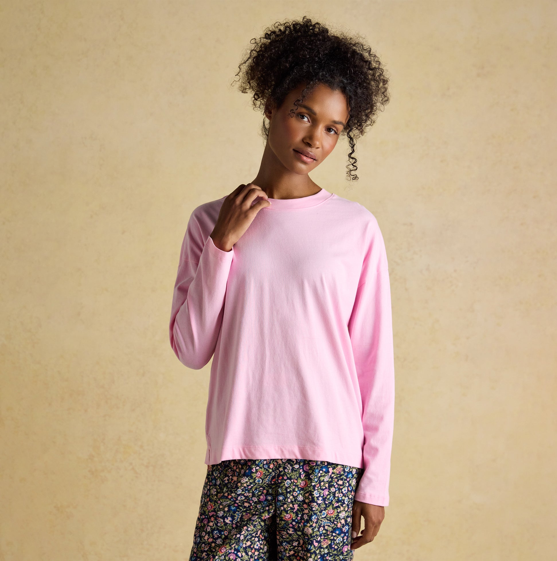 Joules JERSEY Pyjama Top Womens Sweatshirts Pink front view, featuring a model wearing a long sleeve cotton top.