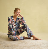 Joules ALMA Womens Pyjama Set Horse Multi front view on model showcasing the multi-colored horse print and long sleeves.