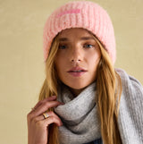 Joules CAVERSHAM Womens Beanie Pink front view on model wearing a gray scarf, showcasing comfort and style.