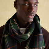 Joules MENS LANGTREE Mens Scarf Navy Check worn by model, showcasing its checked pattern and tasselled ends.