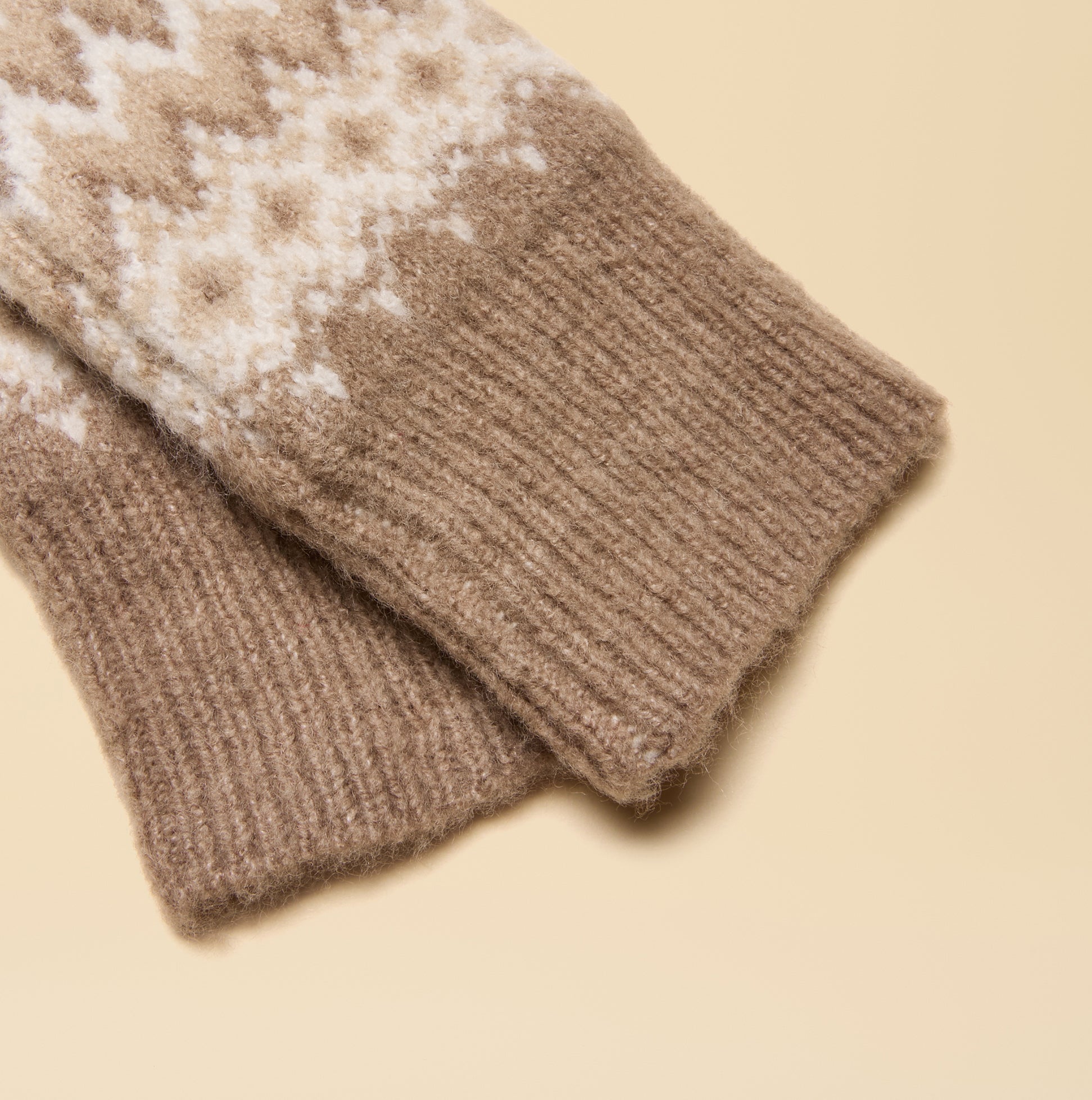 Joules KARA Neutral Fingerless Fairisle Glove Beige detail view showcasing the soft knitted texture and pattern.