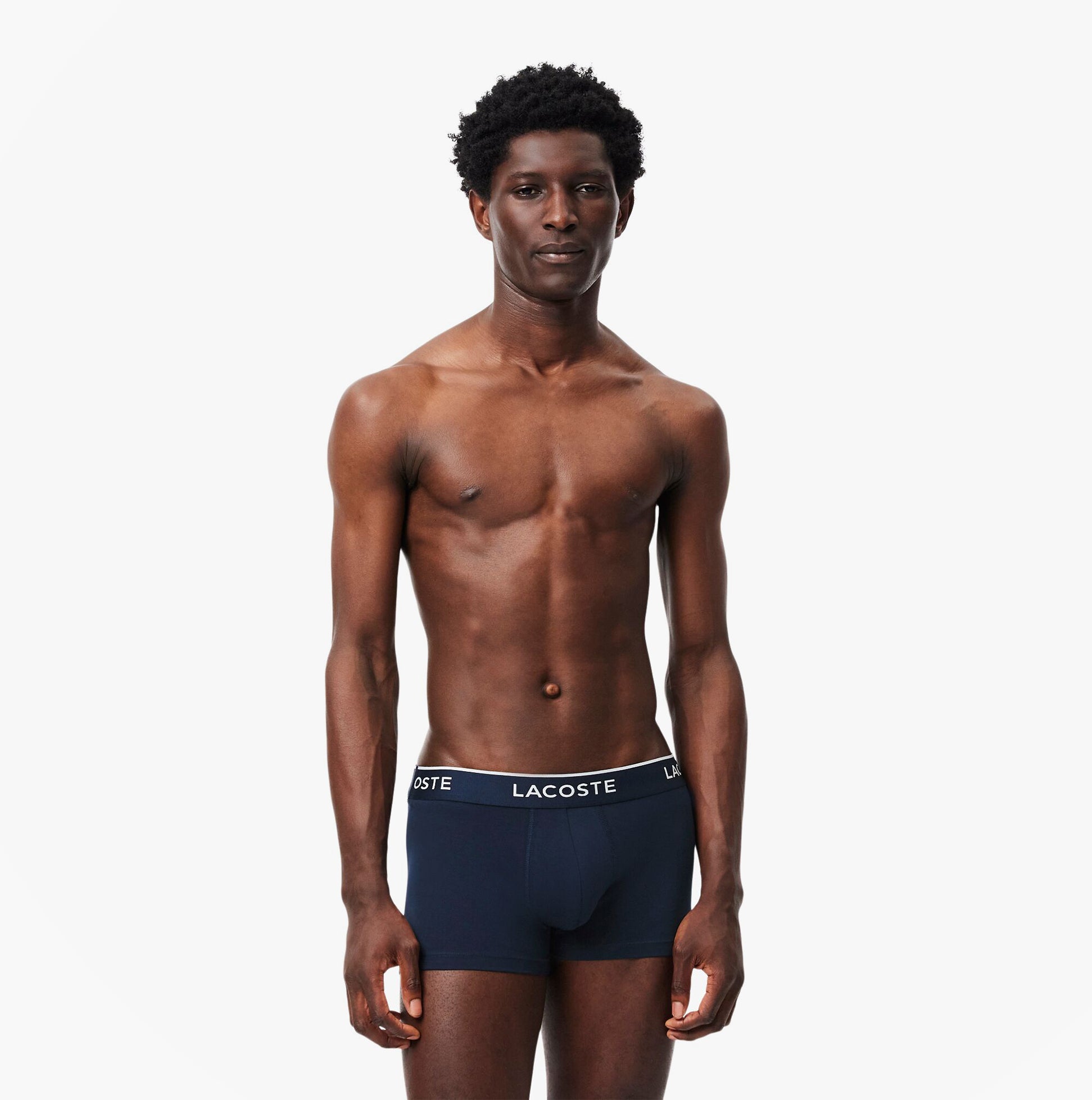 Lacoste 3 Pack Trunks Mens Trunks Navy Blue/Green/Red/Navy Blue front view on a model showing fitted design.