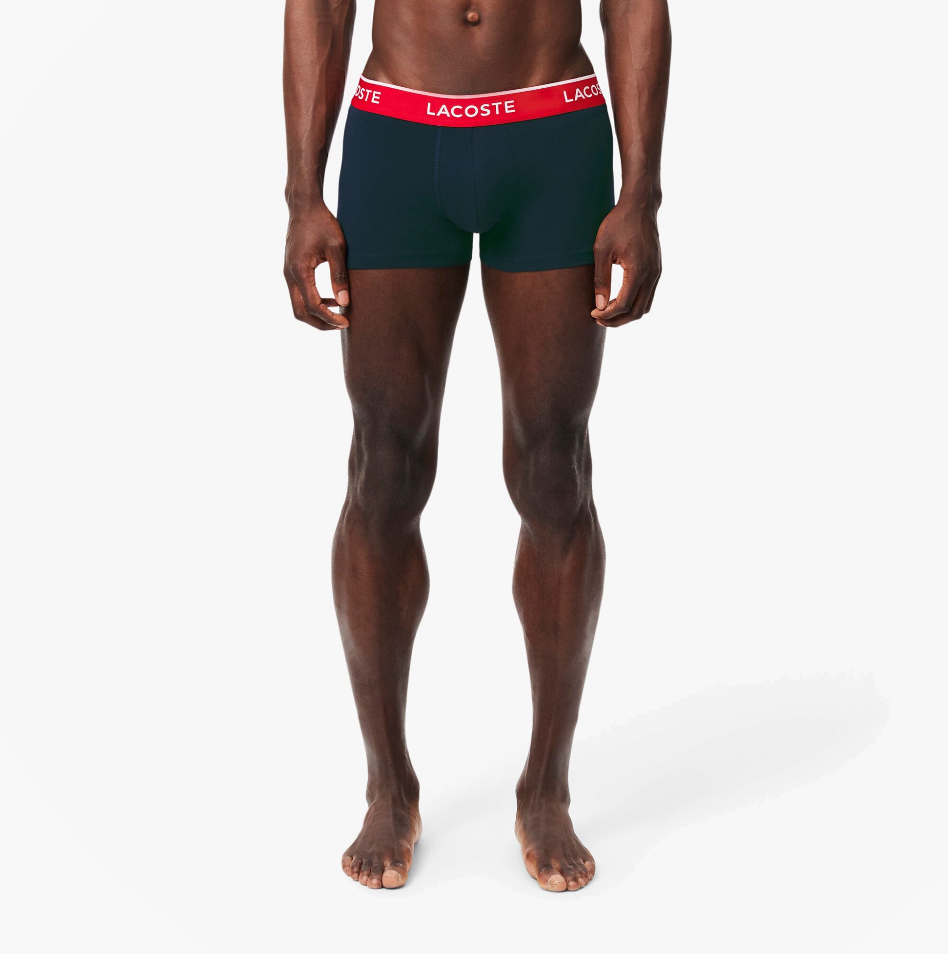 Lacoste 3 Pack Trunks Mens Trunks Navy Blue/Green/Red/Navy Blue front view on model standing, showcasing the comfort fit and waistband.