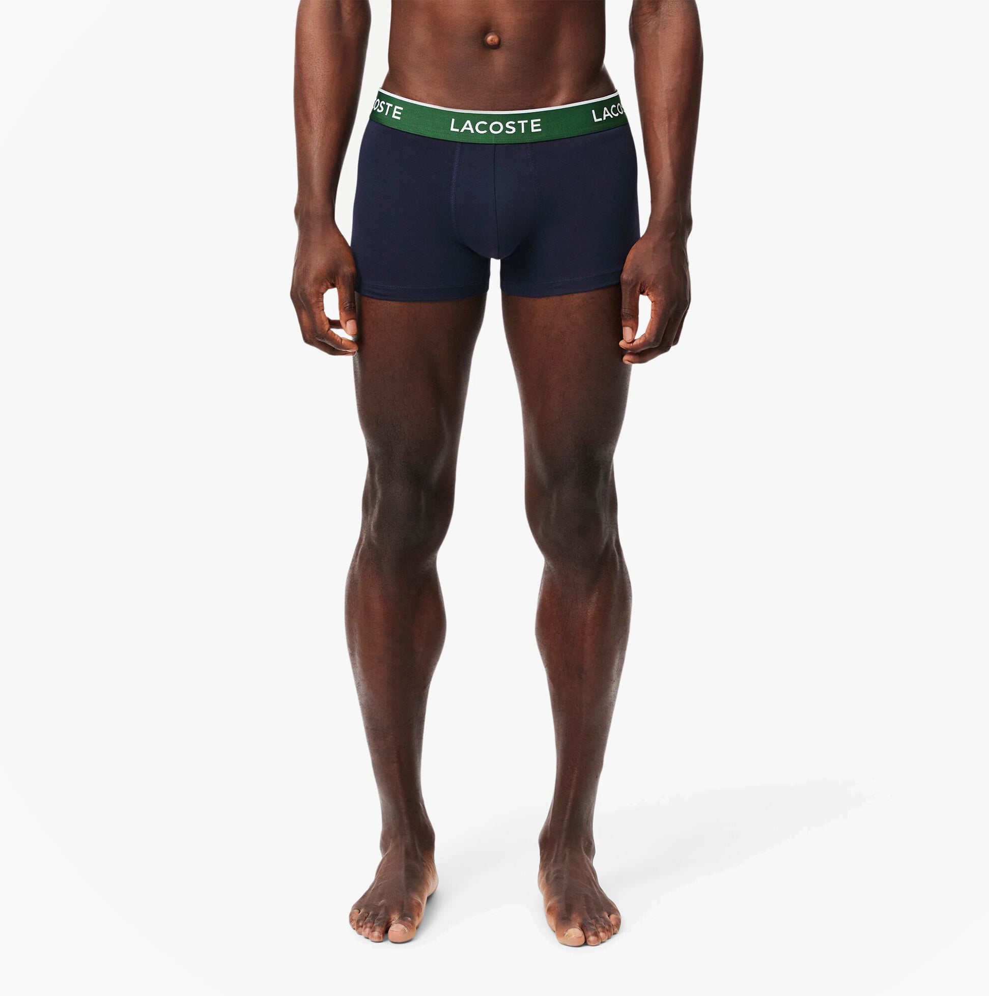 Lacoste 3 Pack Trunks Mens Trunks Navy Blue/Green/Red/Navy Blue front view on model, showcasing the fabric and fit.