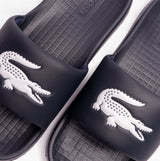 Lacoste SERVE Mens Sliders Navy/White close-up view showing logo and detailing on synthetic upper.