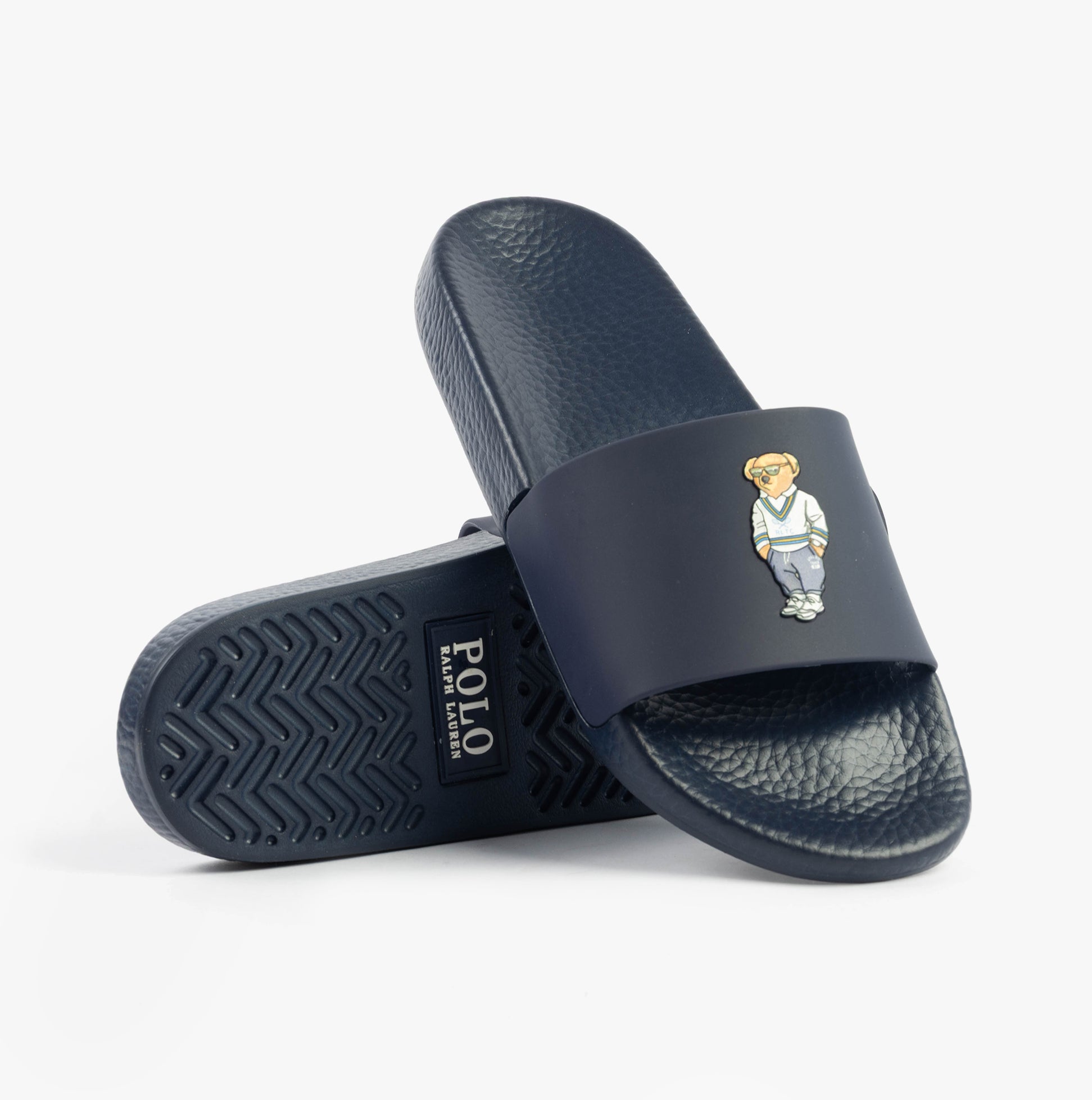 Polo Ralph Lauren POLO SLIDE Mens Sliders Heritage Bear Navy side view showcasing the bear logo and pattern.