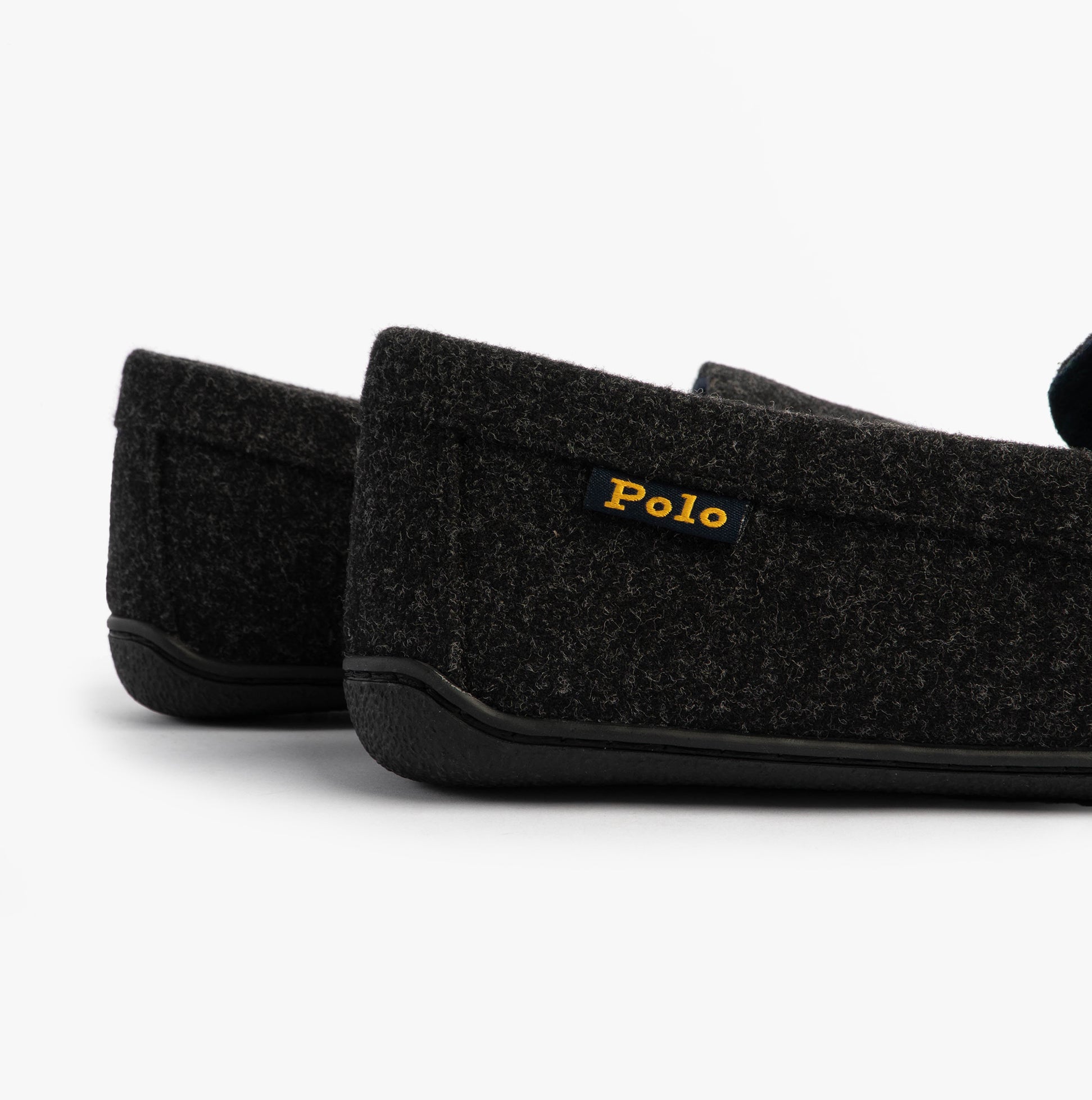 Polo Ralph Lauren BRENAN WOOL Mens Dress Shoe Slippers Black/Cream side view of slippers showing suede upper and rubber sole.