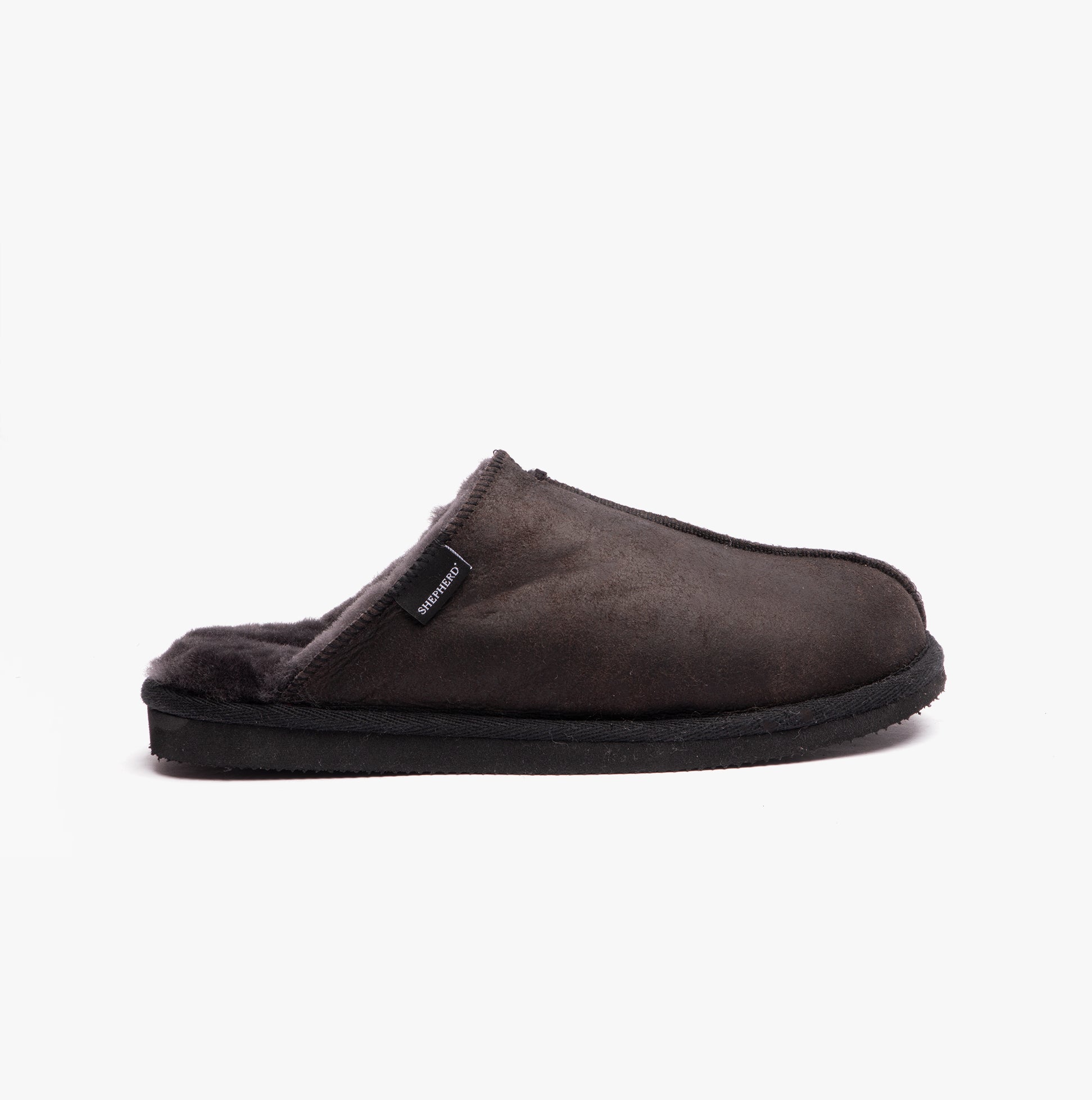 Shepherd HUGO Mens Sheepskin Mules Black side view of black slipper with soft lining.