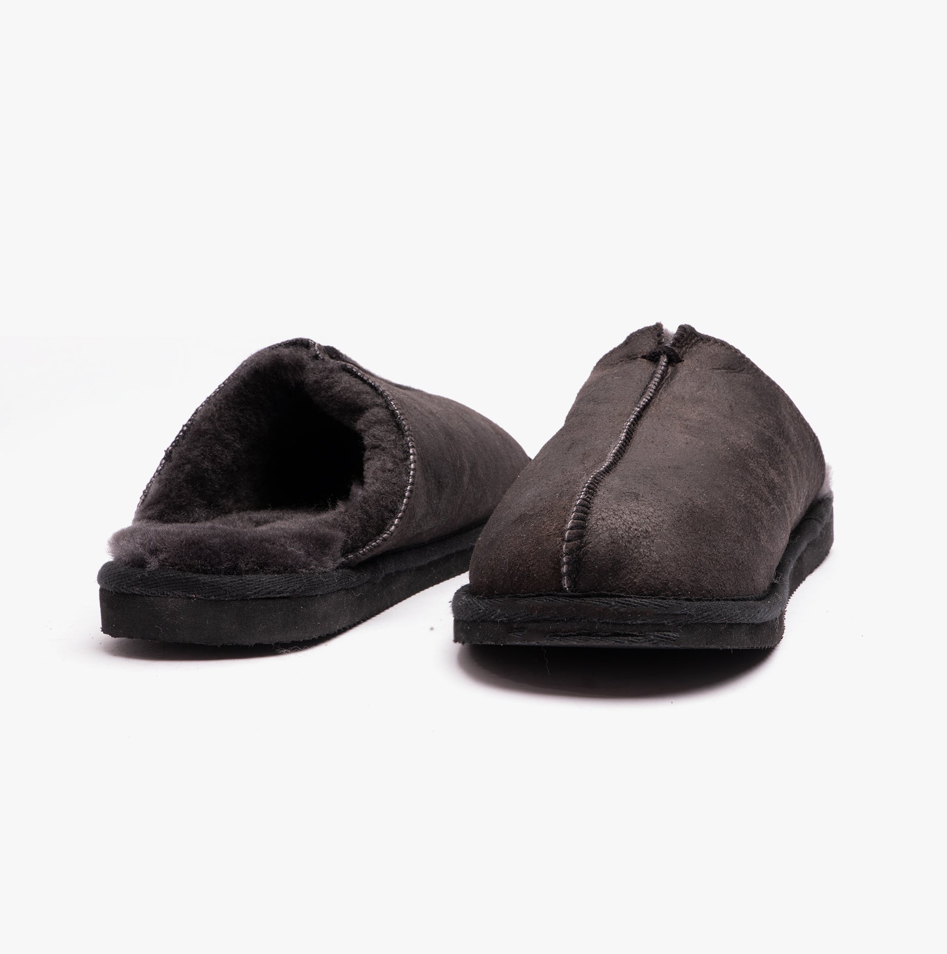 Shepherd HUGO Mens Sheepskin Mules Black side view showing soft upper material and slip-on design for comfort.
