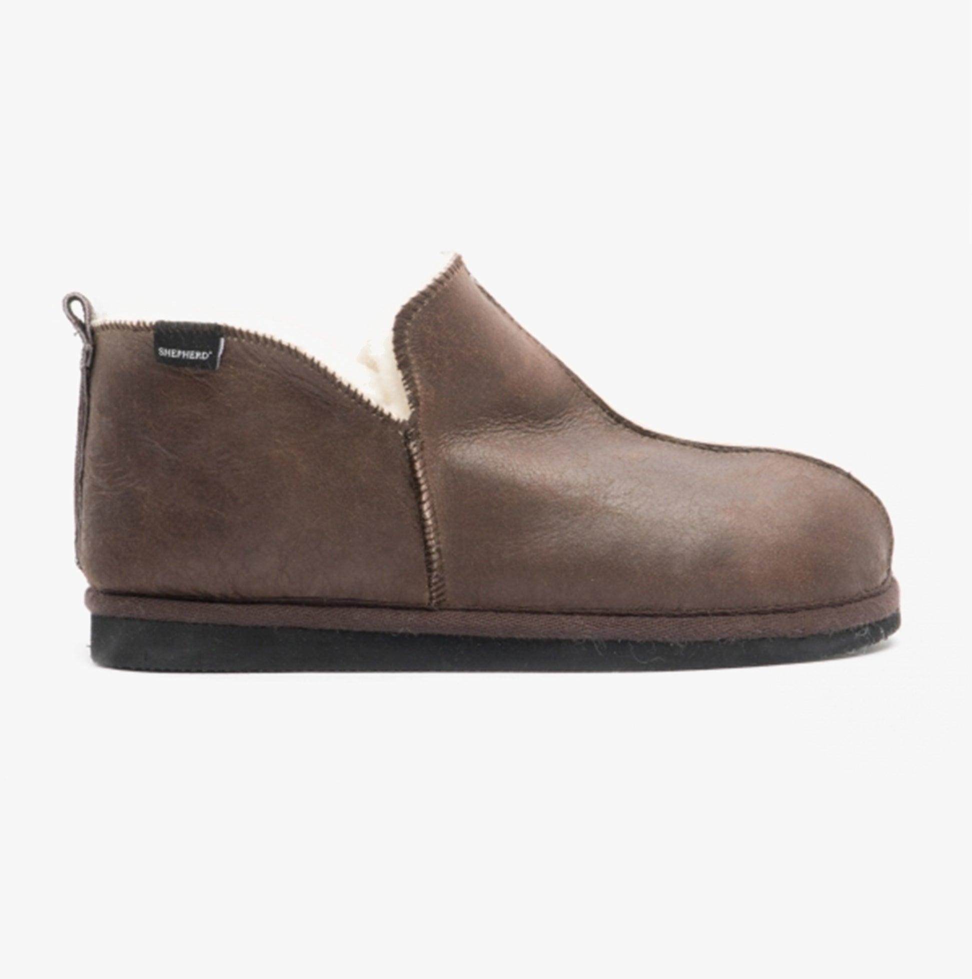 Shepherd ANTON Mens Sheepskin Slipper Boots Oiled Antique side view showcasing soft brown sheepskin material.